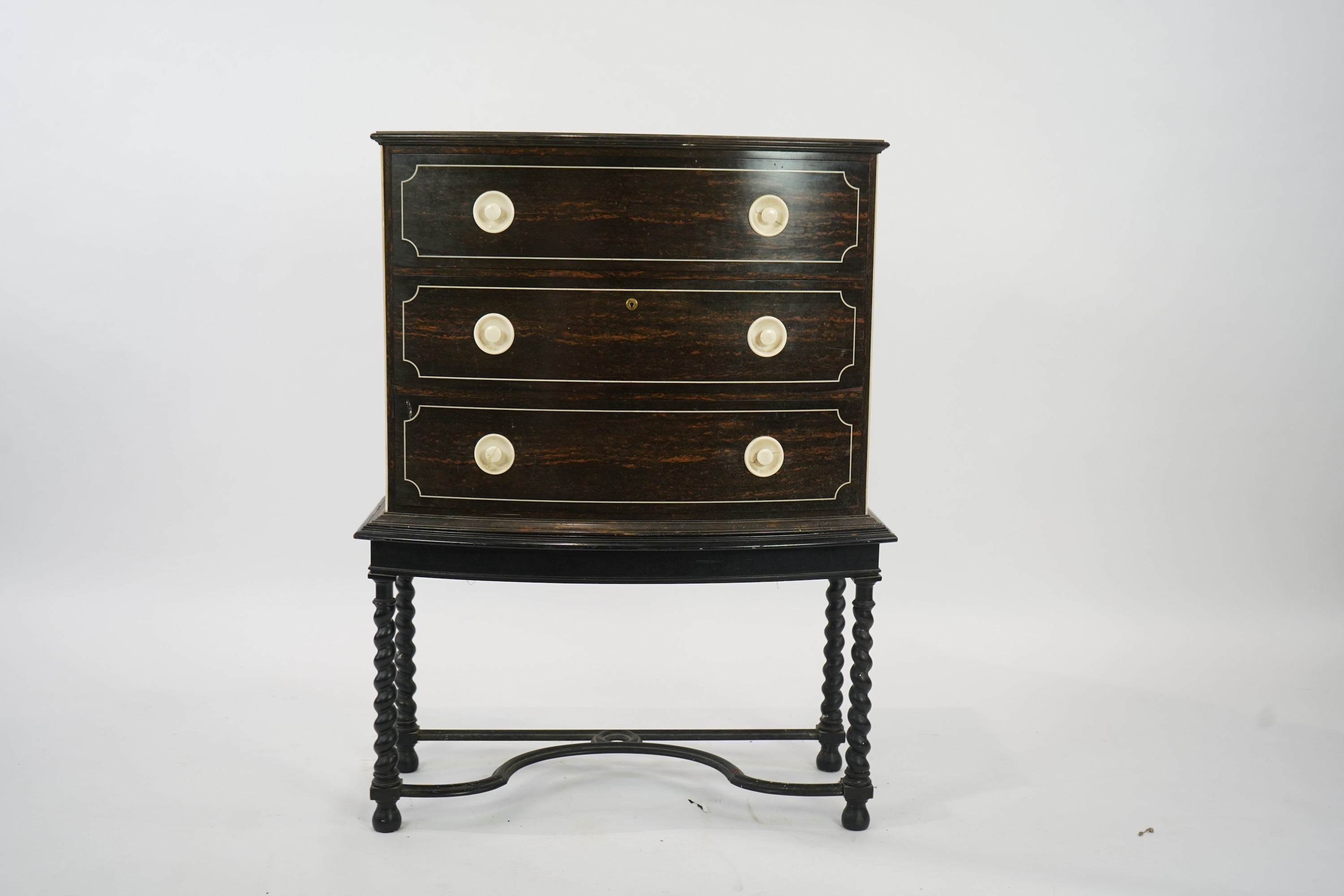 An early 20th century ivory mounted coromandel three drawer bowfront chest, stamped Callow of Mount Street, London
